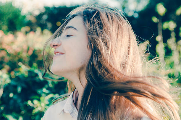 istock Girl Playing with Long Blond Hairs 506069940