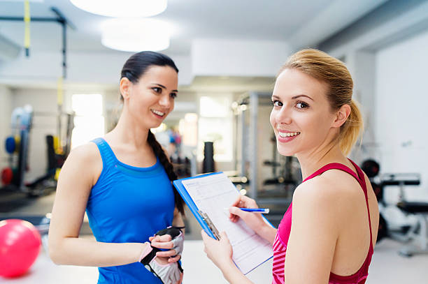 istock Beautiful women in gym 506071314