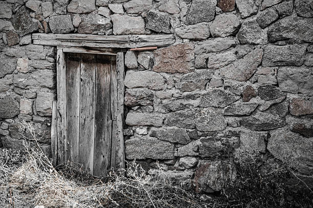 istock Stone wall with wooden door 506072222