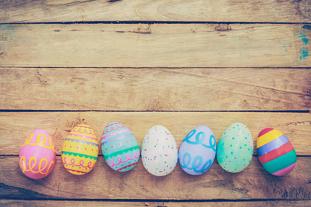 istock Easter eggs on wooden background with vintage tone. 506072446