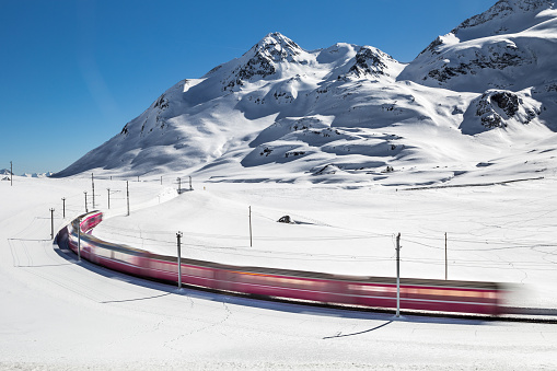 Bernina Express train, also known as Red Little Train, is one of the highest railway in the world, and goes across the Alps between Italy and Swtizerland