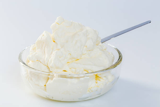 istock cream in a glass bowl isolated concept 506098008