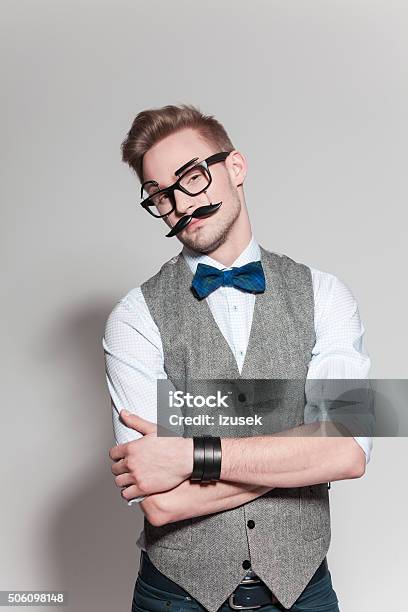 Blonde Man Wearing Tweed Vest Bow Tie And Funny Glasses Stock Photo - Download Image Now
