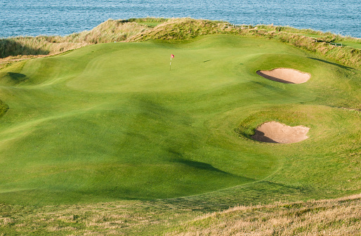 A links golf green with two bunkers