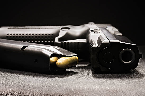 istock handgun on the black background 506101244