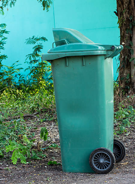 istock green trashcan in the park 506101926