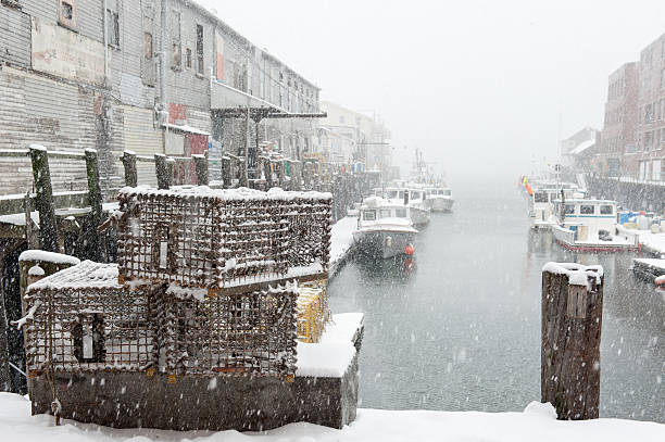 Lobster traps on a pier during a snowstorm in Maine stock photo