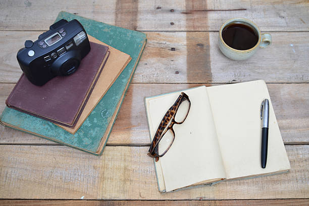 istock cup of the coffee and vintage book. 506102506