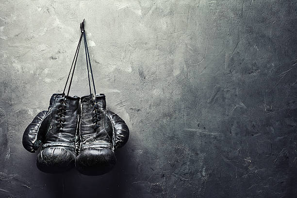 istock old boxing gloves nailed to the textured wall 506102723