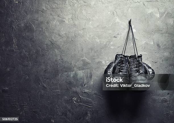 Old Boxing Gloves Nailed To The Textured Wall Stock Photo - Download Image Now - Boxing Glove, Boxing - Sport, Retro Style