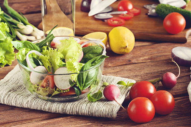 istock fresh salad with a glass of water 506102882