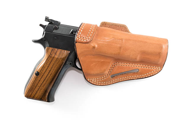 istock 9mm Parabellum pistol in brown leather holster 506103725