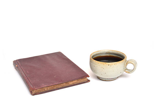istock books and cup of coffee isolated on a white background 506104154
