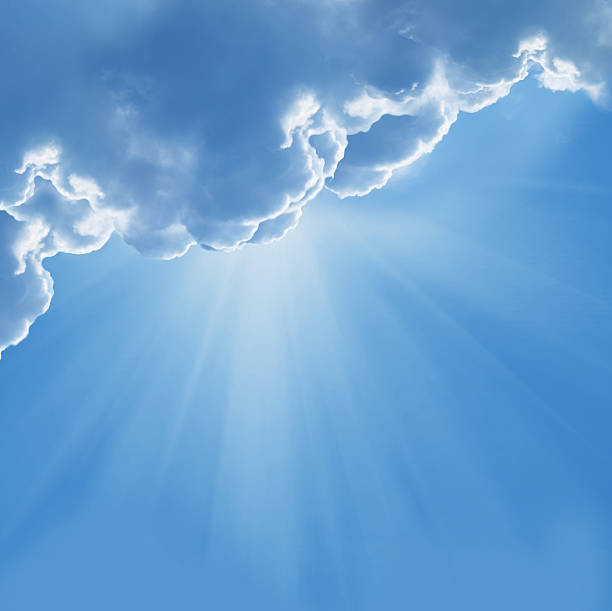 istock blue sky with sun and beautiful clouds 506104275