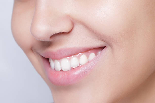 istock beautiful model applying cosmetic cream treatment on her face white 506105510