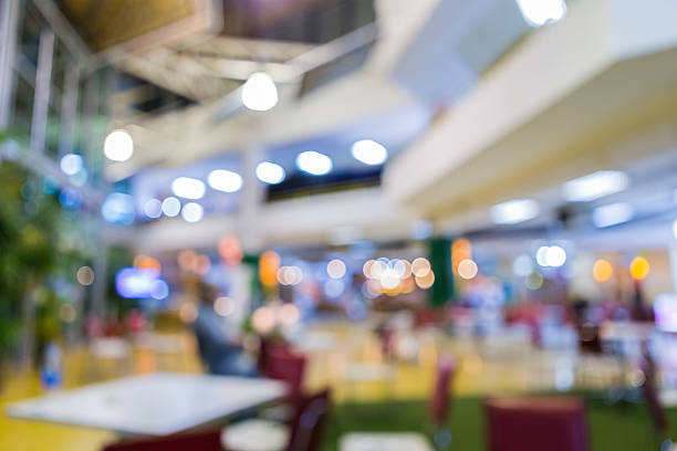 istock blurred shopping mall center 506105904