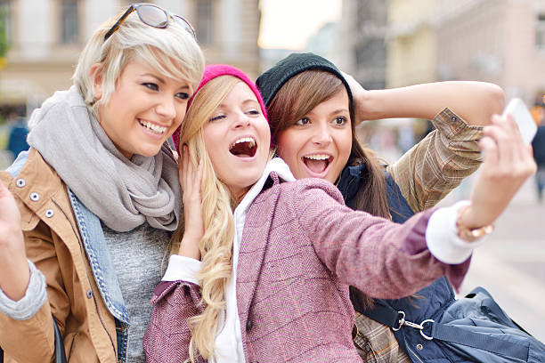istock Young friends together taking selfies 506105949