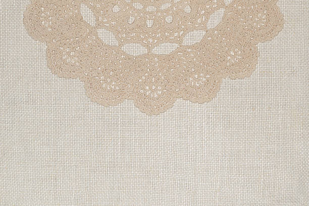 istock Crochet lace on linen background 506105980