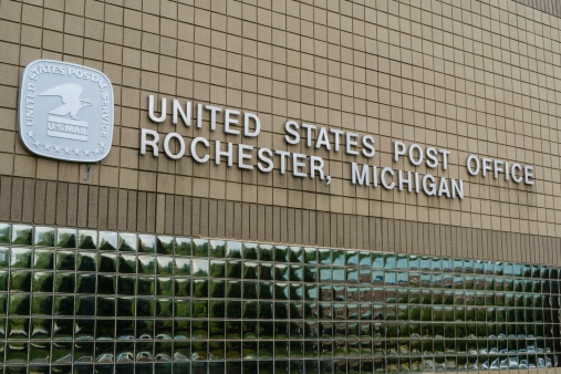 Rochester,Michigan, USA - August 10, 2014: The United States Post Office in downtown Rochester, Michigan. With almost 600,000 employees, the United States Postal Service is the second largest civilian employer in the United States.