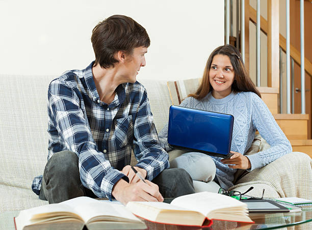 istock student couple  reading, writing, preparing for the session 506106689