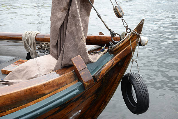 Part of (the bow) an antique Dutch sailing ship (Botter) in the Dutch harbo(u)r of Huizen