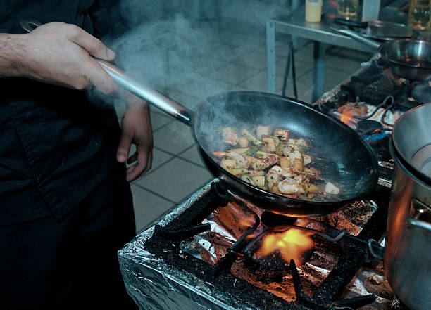 istock Chef is cooking seafood dish, toned 506107447