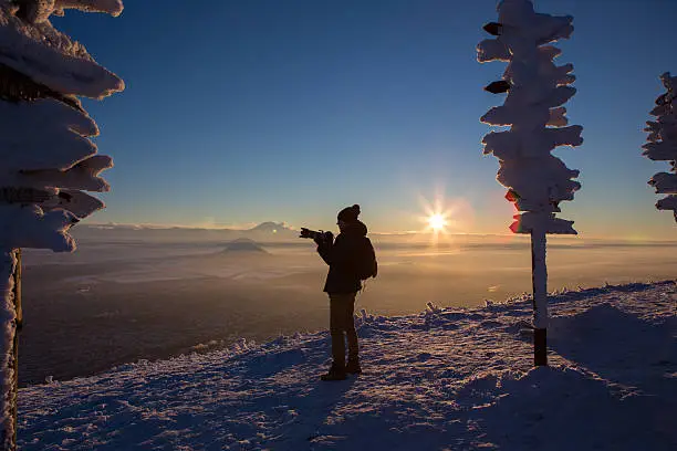 Man photographer, mountains, winter, sunset