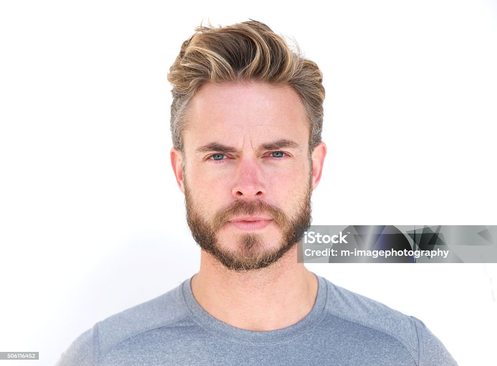 Horizontal portrait of a serious man with beard Close up horizontal portrait of a serious man with beard isolated on white background Men Stock Photo