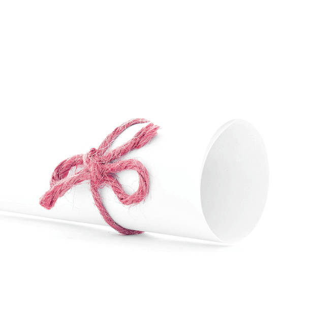 istock Handmade red cord node tied on white paper tube isolated 506117334