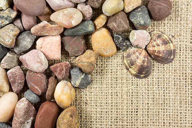 istock sea stones on burlap 506119874
