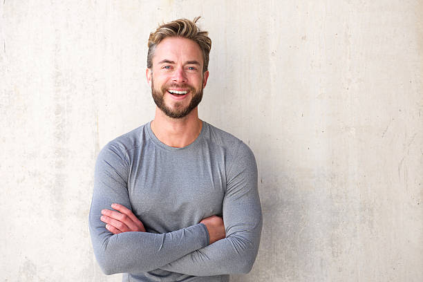 istock Smiling cool guy with arms crossed 506120918
