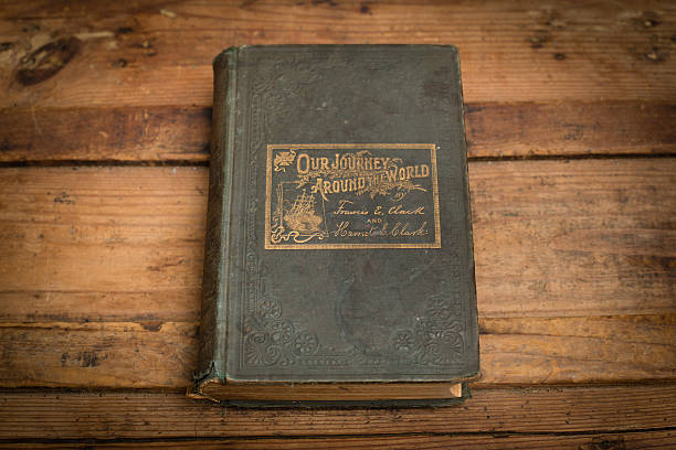 Our Journey Around the World, 1895, Antique Hardback Travel Book Color stock photo of "Our Journey Around the World" - an antique hardback book from 1895 - sitting on an old wooden trunk. 1895 stock pictures, royalty-free photos & images