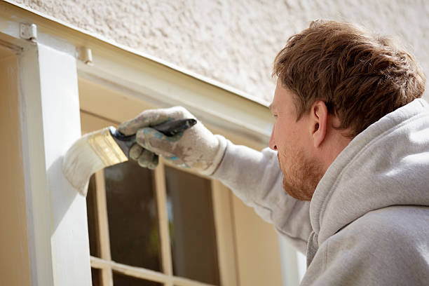istock House Painter Working on Exterior Home Maintenance Improvement Painting Work 506124192