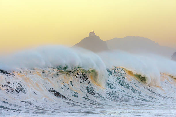 istock wave breaking in Bakio near gaztelugatxe at sunset 506124706