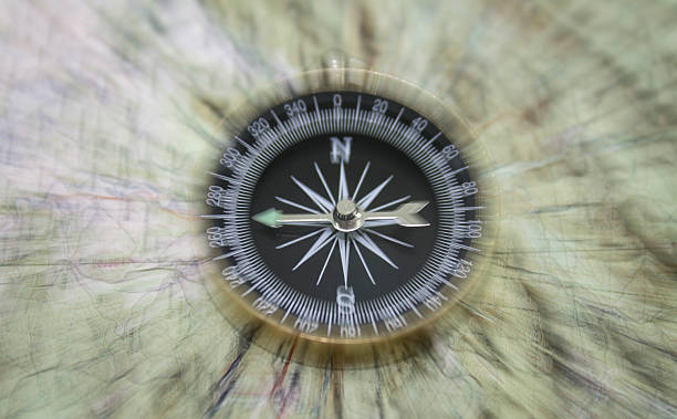 istock Vintage filtered of compass with map 506124930