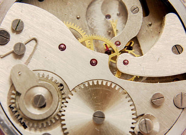 istock Part of clockwork with gears, spring, ruby. Steel and brass 506130997