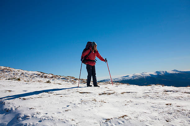istock The girl with the backpack goes through the snow. 506131736
