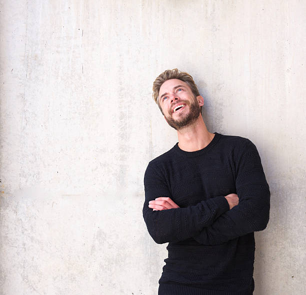 istock Cheerful man laughing and looking up 506131764