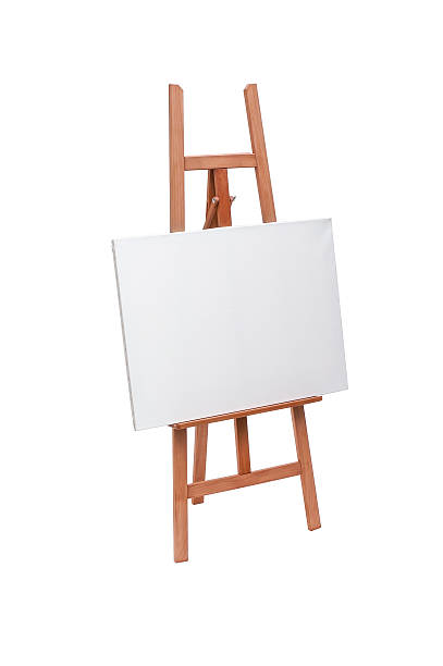 istock White painter canvas on wooden easel isolated on white 506131868