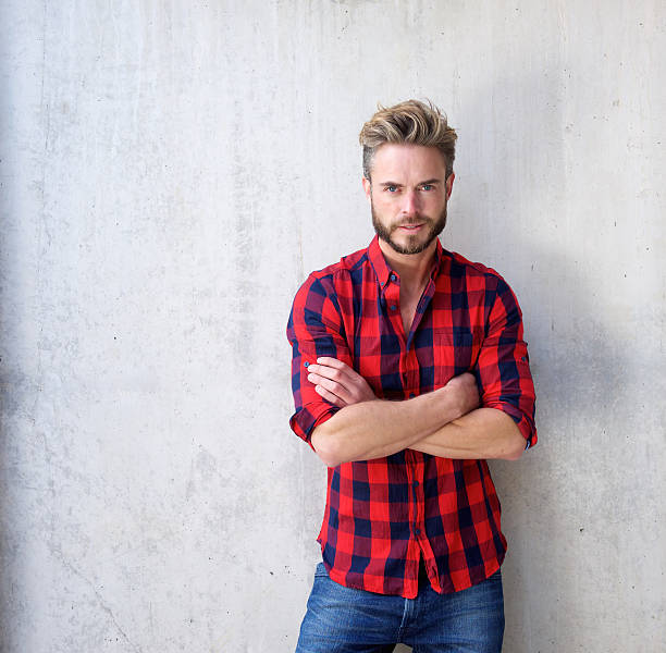 istock Handsome casual man with beard posing with arms crossed 506132524