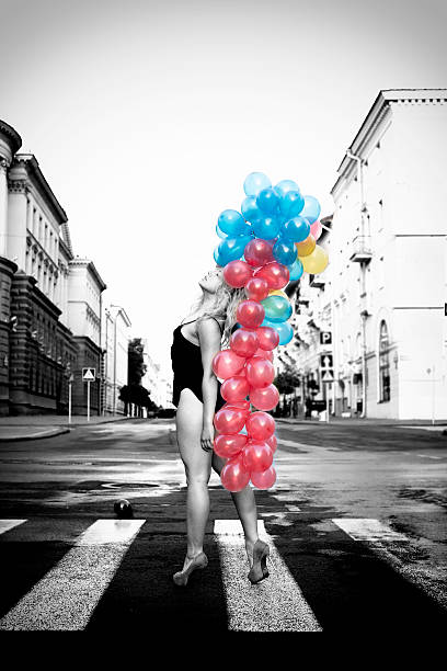 blond beautiful sexy girl with colorful balloons in her hand stock photo