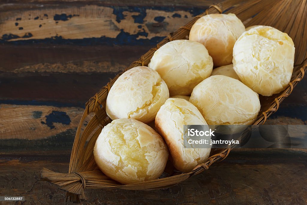 Brazilian snack pao de queijo  (cheese bread) in wicker basket Brazilian snack pao de queijo  (cheese bread) in wicker basket. Selective focus. Copy space Chipá Stock Photo