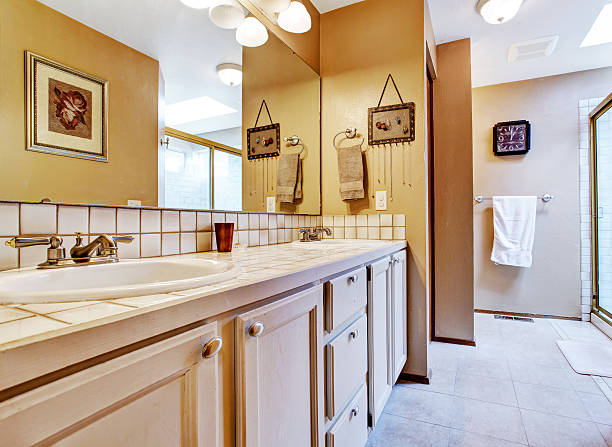 istock Golden long bathroom with brown walls. 506133289