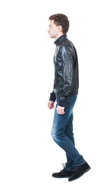 istock Back view of going  handsome man in jacket. 506133358