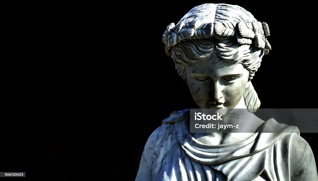 Ancient Beauty Marble sculpture of a pleasant woman. Statue Stock Photo