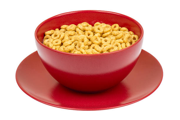 Whole grain cheerios in red bowl isolated. stock photo