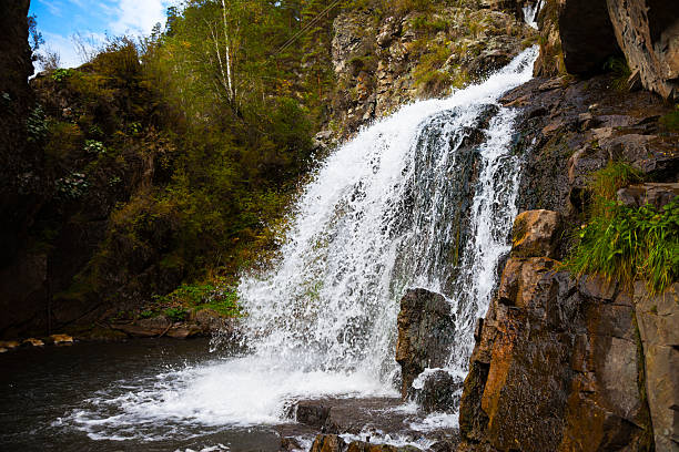 istock Beautiful breathtaking Waterfall in the Mountains 506133606