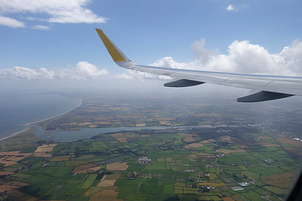 istock Wing of an airplane flying 506133738