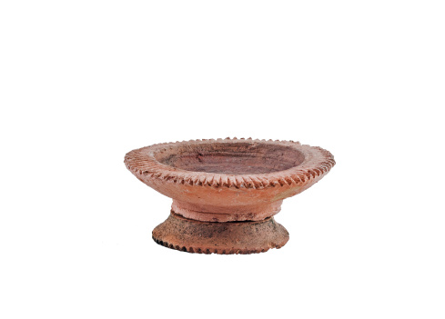 Isolated of Ancient Lanna style Candle holder with stand made from handmade clay pottery