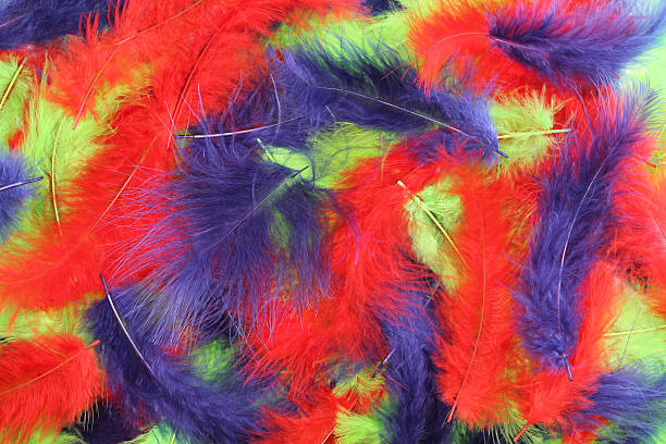 istock Background - small red, blue, green plumes situated irregularly 506134522